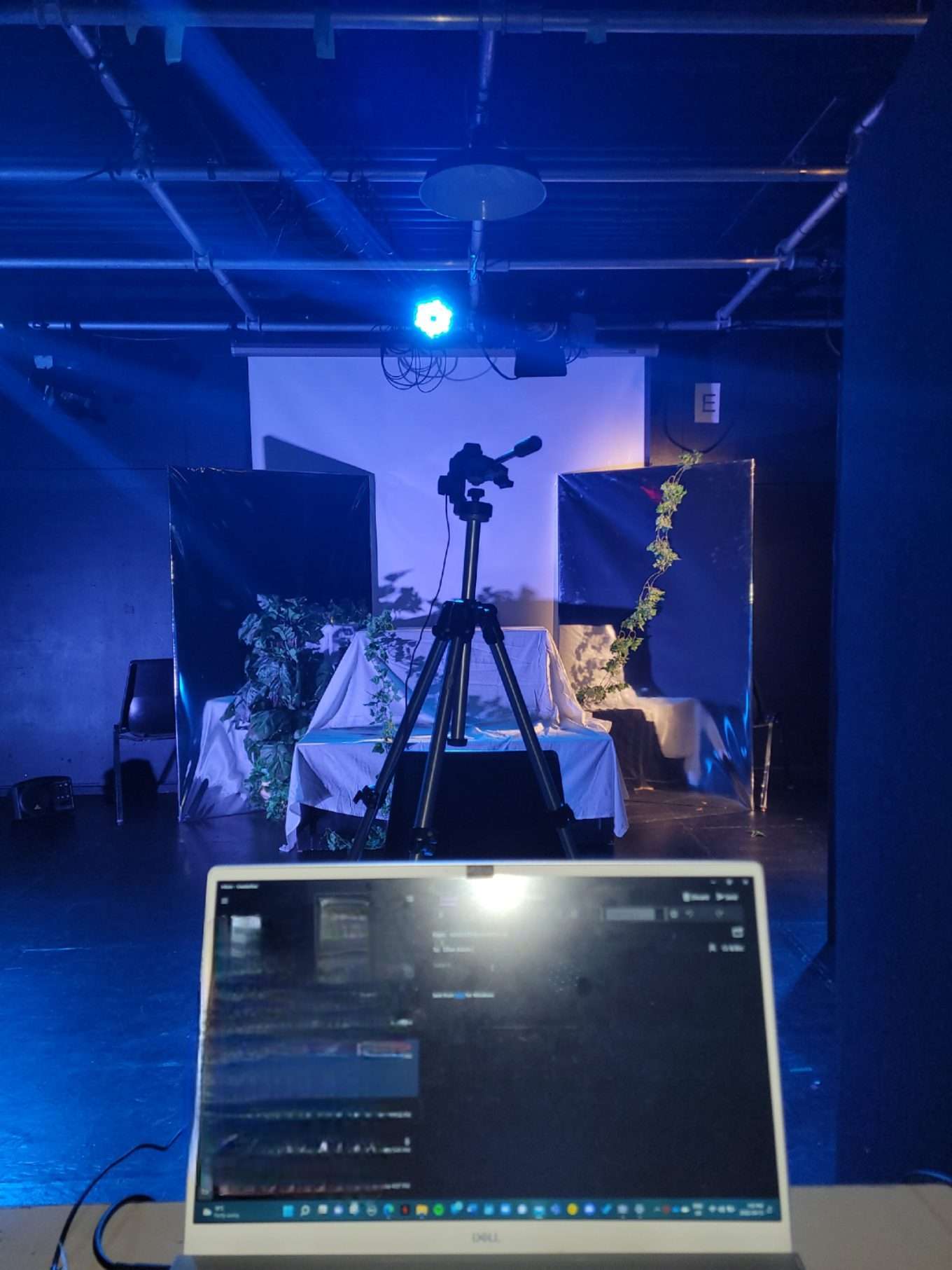 Lilian Adom (Astoria), Angelo Feliciano (Cyrus). View of Centre Stage and Audience Seating Placement. Rehearsal photos of Scenes 5 to 9 of "The Inevitable" by Emily Radcliffe. UWaterloo 'THPERF 361: Approaches to Directing'. Winter 2022. Directed by Emily Radcliffe. Set/Light/Costume/Sound Design by Emily Radcliffe.